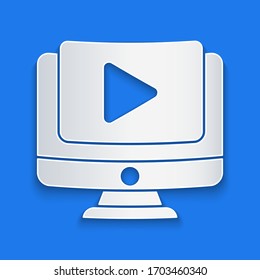 Paper cut Online play video icon isolated on blue background. Computer monitor and film strip with play sign. Paper art style. Vector Illustration