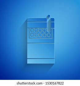 Paper cut Open cigarettes pack box icon isolated on blue background. Cigarettes pack. Paper art style. Vector Illustration