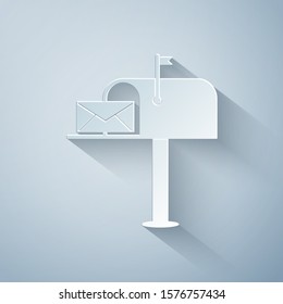 Paper cut Open mail box with an envelope icon isolated on grey background. Paper art style. Vector Illustration