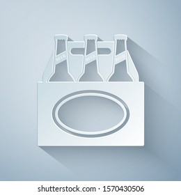 Paper cut Pack of beer bottles icon isolated on grey background. Case crate beer box sign. Paper art style. Vector Illustration