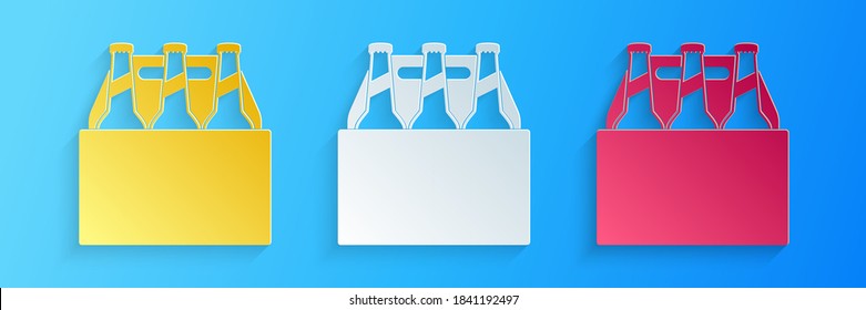 Paper cut Pack of beer bottles icons isolated on blue background. Case crate beer box sign. Paper art style. Vector.