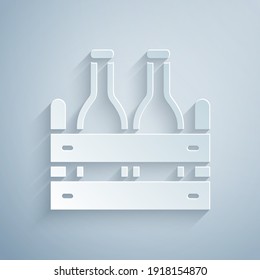 Paper cut Pack of beer bottles icon isolated on grey background. Wooden box and beer bottles. Case crate beer box sign. Paper art style. Vector.