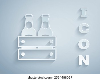 Paper cut Pack of beer bottles icon isolated on grey background. Wooden box and beer bottles. Case crate beer box sign. Paper art style. Vector