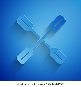 Paper cut Paddle icon isolated on blue background. Paddle boat oars. Paper art style. Vector