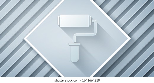 Paper cut Paint roller brush icon isolated on grey background. Paper art style. Vector Illustration