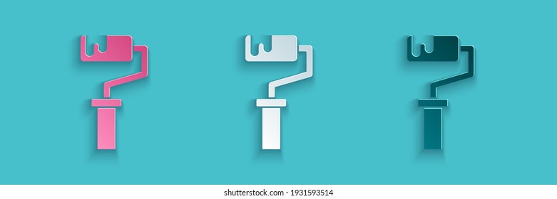 Paper cut Paint roller brush icon isolated on blue background. Paper art style. Vector