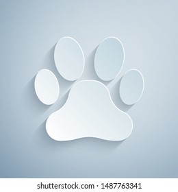 Paper cut Paw print icon isolated on grey background. Dog or cat paw print. Animal track. Paper art style. Vector Illustration