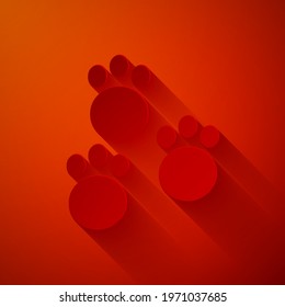 Paper cut Paw print icon isolated on red background. Dog or cat paw print. Animal track. Paper art style. Vector
