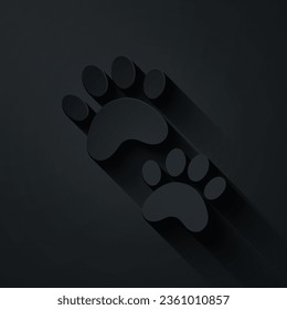 Paper cut Paw print icon isolated on black background. Dog or cat paw print. Animal track. Paper art style. Vector