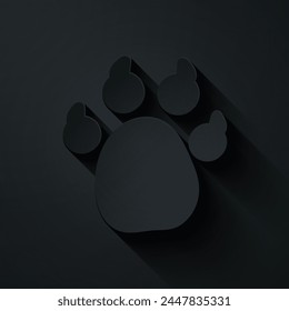 Paper cut Paw print icon isolated on black background. Dog or cat paw print. Animal track. Paper art style. Vector