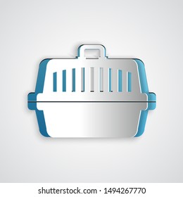 Paper cut Pet carry case icon isolated on grey background. Carrier for animals, dog and cat. Container for animals. Animal transport box. Paper art style. Vector Illustration