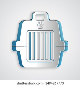 Paper cut Pet carry case icon isolated on grey background. Carrier for animals, dog and cat. Container for animals. Animal transport box. Paper art style. Vector Illustration