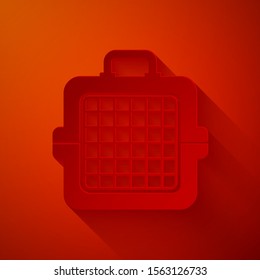 Paper cut Pet carry case icon isolated on red background. Carrier for animals, dog and cat. Container for animals. Animal transport box. Paper art style. Vector Illustration