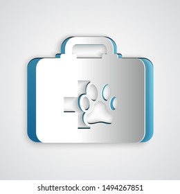 Paper cut Pet first aid kit icon isolated on grey background. Dog or cat paw print. Clinic box. Paper art style. Vector Illustration