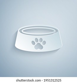 Paper cut Pet food bowl for cat or dog icon isolated on grey background. Dog or cat paw print. Paper art style. Vector