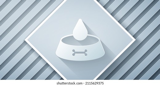Paper cut Pet food bowl for cat or dog icon isolated on grey background. Dog or cat paw print. Paper art style. Vector