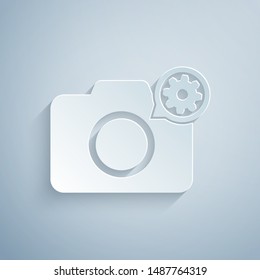 Paper cut Photo camera and gear icon isolated on grey background. Adjusting app, service concept, setting options, maintenance, repair, fixing. Paper art style. Vector Illustration