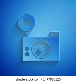 Paper cut Photo camera icon isolated on blue background. Foto camera icon. Paper art style. Vector Illustration