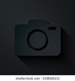 Paper cut Photo camera icon isolated on black background. Foto camera icon. Paper art style. Vector Illustration