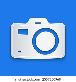 Paper cut Photo camera icon isolated on blue background. Foto camera. Digital photography. Paper art style. Vector