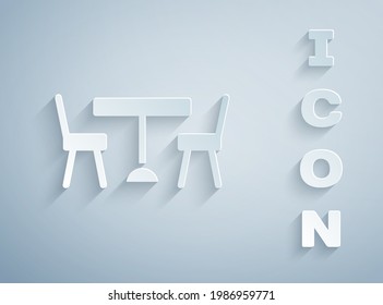 Paper cut Picnic table with chairs on either side of the table icon isolated on grey background. Paper art style. Vector