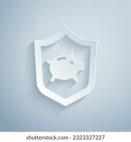 Paper cut Piggy bank with shield icon isolated on grey background. Saving or accumulation of money, investment. Insurance concept. Paper art style. Vector