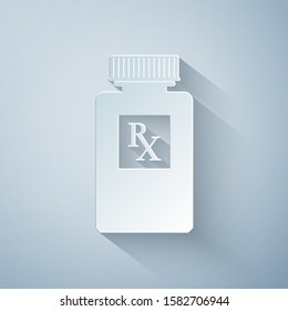 Paper cut Pill bottle with Rx sign and pills icon isolated on grey background. Pharmacy design. Rx as a prescription symbol on drug medicine bottle. Paper art style. Vector Illustration