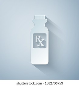 Paper cut Pill bottle with Rx sign and pills icon isolated on grey background. Pharmacy design. Rx as a prescription symbol on drug medicine bottle. Paper art style. Vector Illustration