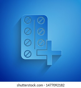 Paper cut Pills in blister pack icon isolated on blue background. Medical drug package for tablet: vitamin, antibiotic, aspirin. Paper art style. Vector Illustration
