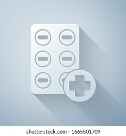 Paper cut Pills in blister pack icon isolated on grey background. Medical drug package for tablet, vitamin, antibiotic, aspirin. Paper art style. Vector Illustration