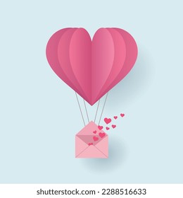 Paper cut pink heart shape origami made hot air balloon flying in the sky with love letter filled with many hearts