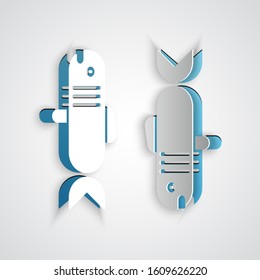 Paper cut Pisces zodiac sign icon isolated on grey background. Astrological horoscope collection. Paper art style. Vector Illustration