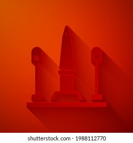 Paper cut Place De La Concorde in Paris, France icon isolated on red background. Paper art style. Vector