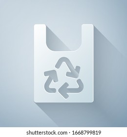 Paper cut Plastic bag with recycle icon isolated on grey background. Bag with recycling symbol. Paper art style. Vector Illustration