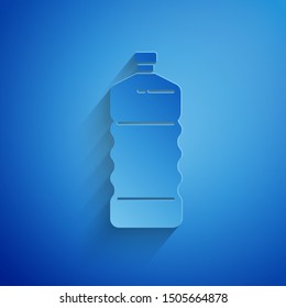 Paper cut Plastic bottle icon isolated on blue background. Paper art style. Vector Illustration