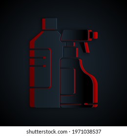 Paper cut Plastic bottles for laundry detergent, bleach, dishwashing liquid or another cleaning agent icon isolated on black background. Paper art style. Vector Illustration