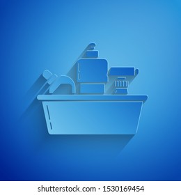 Paper cut Plastic bottles for liquid laundry detergent, bleach, dishwashing liquid or another cleaning agent icon isolated on blue background. Paper art style. Vector Illustration