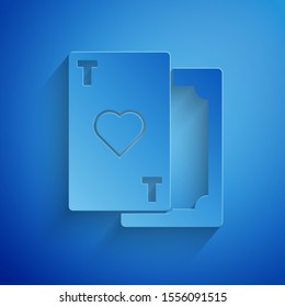 Paper cut Playing card with heart symbol icon isolated on blue background. Casino gambling. Paper art style. Vector Illustration