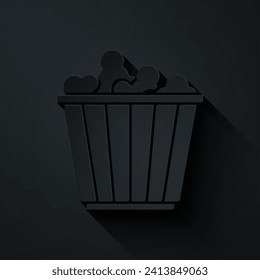 Paper cut Popcorn in cardboard box icon isolated on black background. Popcorn bucket box. Paper art style. Vector