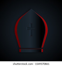 Paper cut Pope hat icon isolated on black background. Christian hat sign. Paper art style. Vector Illustration