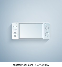 Paper cut Portable video game console icon isolated on grey background. Gamepad sign. Gaming concept. Paper art style. Vector Illustration