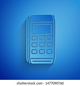 Paper cut Pos terminal icon isolated on blue background. Payment terminal transaction. Pay by card. Paper art style. Vector Illustration