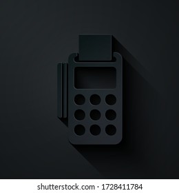 Paper cut POS terminal with inserted credit card and printed reciept icon isolated on black background. NFC payment concept. Paper art style. Vector Illustration