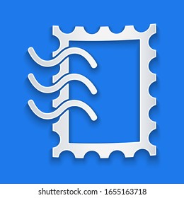 Paper cut Postal stamp icon isolated on blue background. Paper art style. Vector Illustration