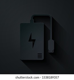 Paper cut Power bank with different charge cable icon isolated on black background. Portable charging device. Paper art style. Vector Illustration