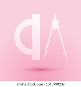 Paper cut Protractor and drawing compass icon isolated on pink background. Drawing professional instrument. Geometric equipment. Education sign. Paper art style. Vector.