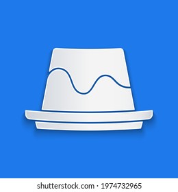 Paper cut Pudding custard with caramel glaze icon isolated on blue background. Paper art style. Vector
