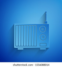 Paper cut Radio with antenna icon isolated on blue background. Paper art style. Vector Illustration