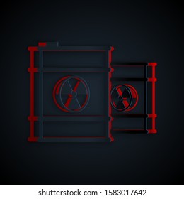 Paper cut Radioactive waste in barrel icon isolated on black background. Toxic refuse keg. Radioactive garbage emissions, environmental pollution. Paper art style. Vector Illustration