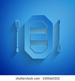 Paper cut Rafting boat icon isolated on blue background. Inflatable boat with paddles. Water sports, extreme sports, holiday, vacation. Paper art style. Vector Illustration